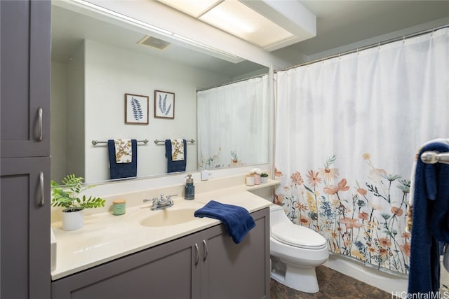 bathroom featuring vanity, a shower with curtain, and toilet