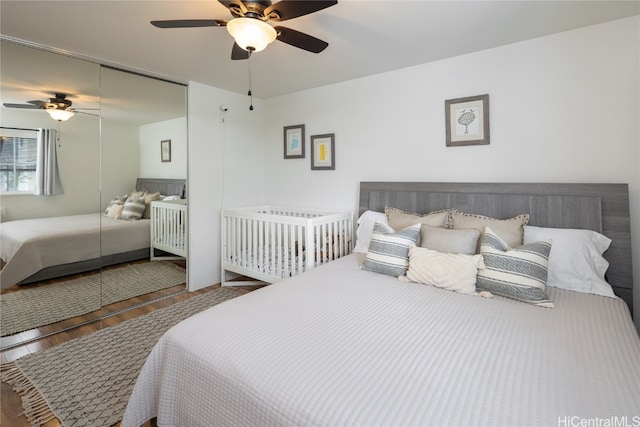 bedroom featuring hardwood / wood-style floors and ceiling fan