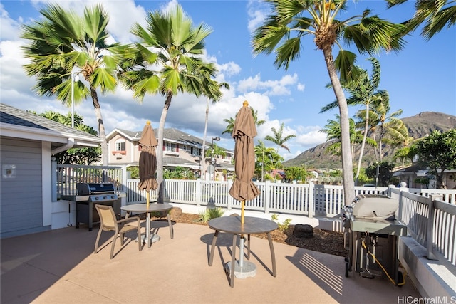 view of patio / terrace featuring a mountain view and grilling area