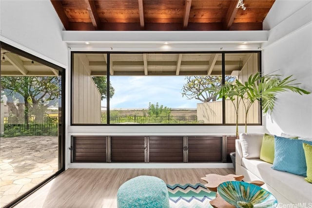 sunroom / solarium with wood ceiling and lofted ceiling with beams