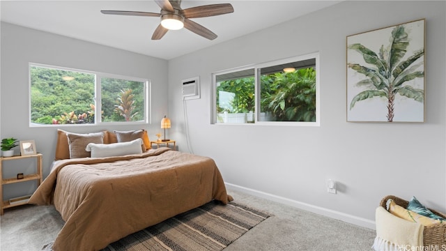 bedroom featuring an AC wall unit, carpet, and ceiling fan