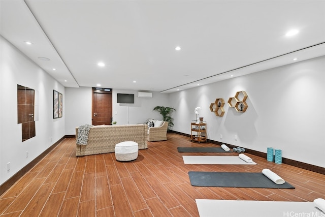 workout room featuring light hardwood / wood-style floors