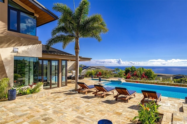 view of swimming pool with a patio area