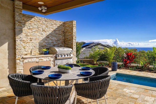 view of patio with exterior kitchen and grilling area