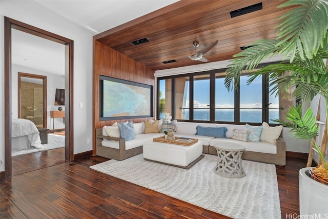 living room featuring wooden ceiling, ceiling fan, a water view, and dark hardwood / wood-style flooring