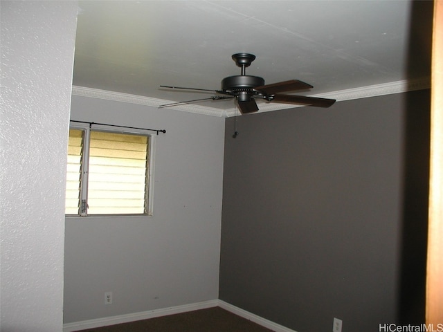 empty room featuring ceiling fan and ornamental molding