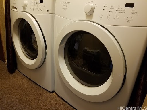 washroom with washer and dryer