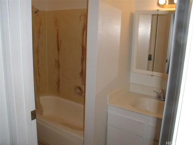 bathroom with vanity and shower / tub combination