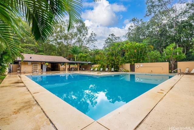 view of swimming pool with a patio