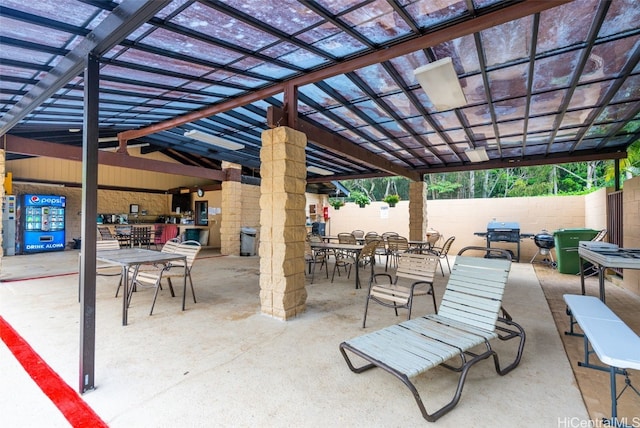 view of patio / terrace with a pergola and area for grilling