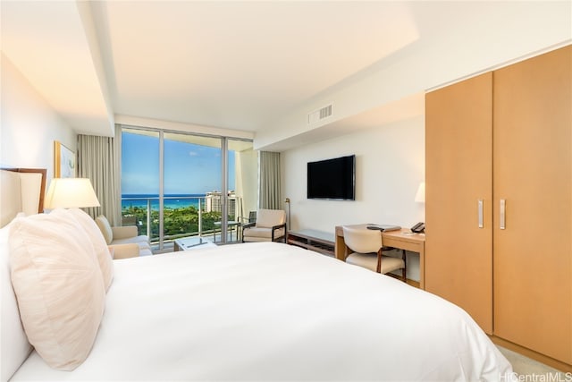 bedroom with access to outside and floor to ceiling windows