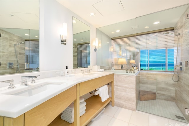 bathroom featuring vanity and independent shower and bath