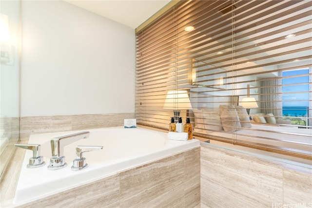 bathroom with tiled tub