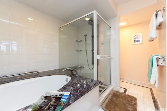 bathroom with shower with separate bathtub