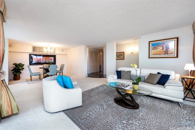 carpeted living room with a textured ceiling