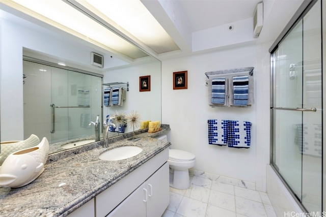 full bathroom with vanity, toilet, and combined bath / shower with glass door