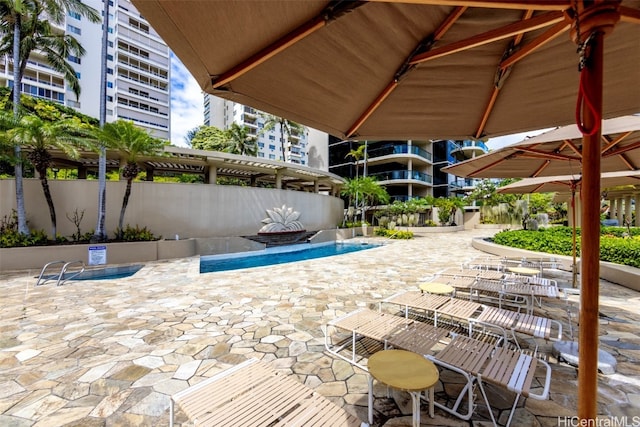 view of patio with a community pool