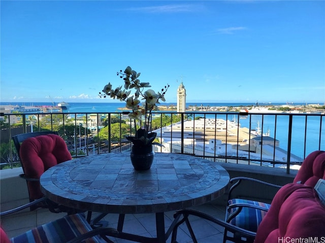 balcony featuring a water view