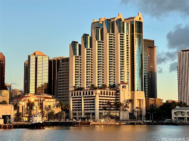 outdoor building at dusk featuring a water view