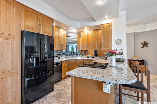 kitchen featuring a kitchen breakfast bar, black appliances, light stone countertops, and kitchen peninsula