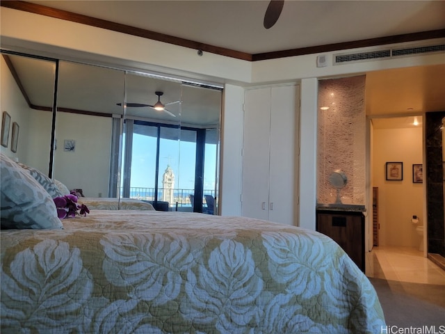 bedroom with crown molding, tile patterned flooring, and ceiling fan