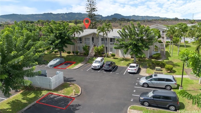 birds eye view of property with a mountain view