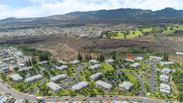 birds eye view of property with a mountain view