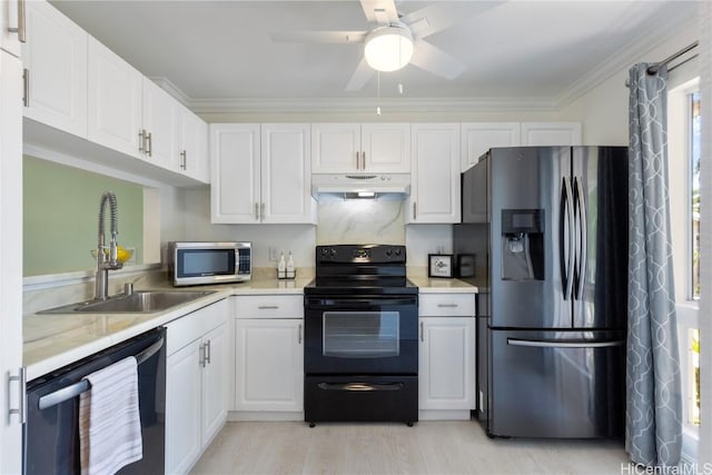 kitchen with sink, white cabinetry, ornamental molding, appliances with stainless steel finishes, and ceiling fan