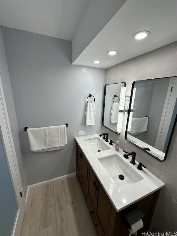 bathroom featuring vanity and wood-type flooring