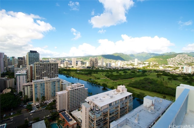 birds eye view of property featuring a water and mountain view