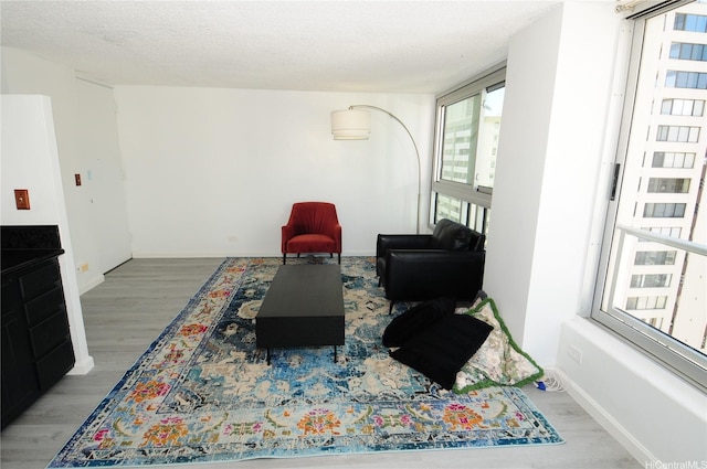 2421 Tusitala St Unit 1402, Honolulu, HI 96815 - sitting room featuring wood finished floors and baseboards