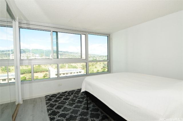 bedroom with hardwood / wood-style floors