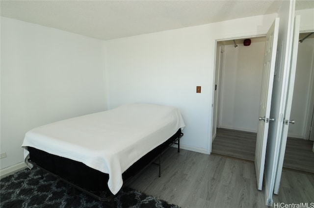 bedroom featuring hardwood / wood-style floors