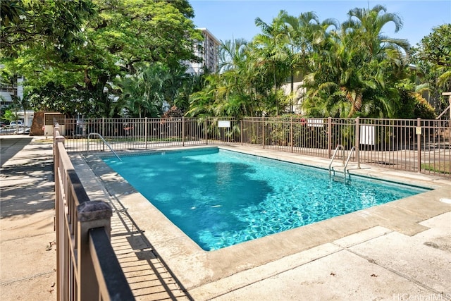 view of swimming pool featuring a patio area