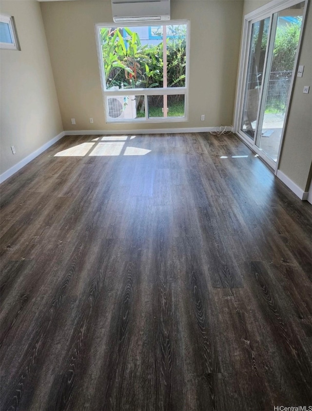 94-609 Kawele Pl, Waipahu, HI 96797 - empty room featuring wood finished floors, baseboards, and a wall mounted AC