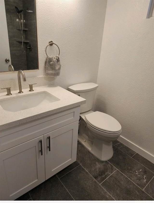 94-609 Kawele Pl, Waipahu, HI 96797 - bathroom with vanity, tile patterned floors, a textured wall, and toilet