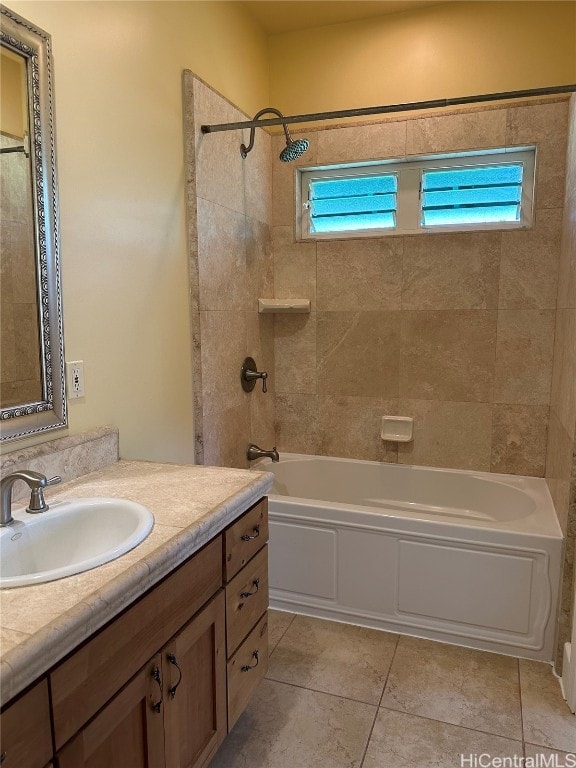 bathroom with vanity, tile patterned floors, and tiled shower / bath combo