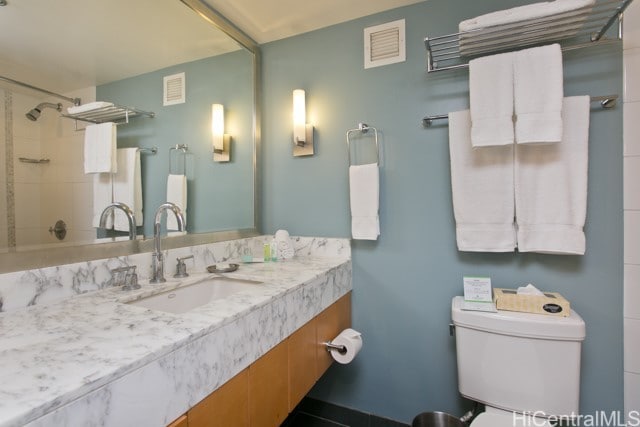 bathroom with vanity and toilet