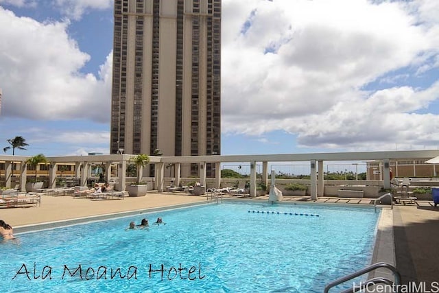 view of swimming pool with a patio