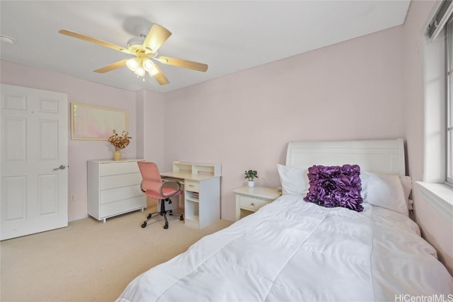 bedroom with light colored carpet and ceiling fan