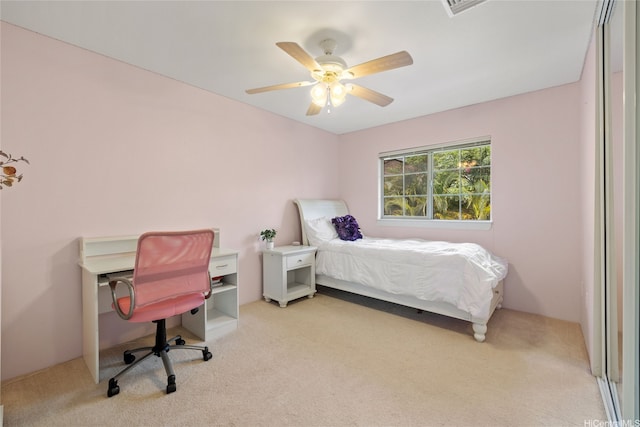 carpeted bedroom featuring ceiling fan