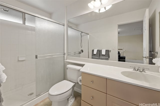 full bath featuring tile patterned floors, a shower stall, toilet, and vanity