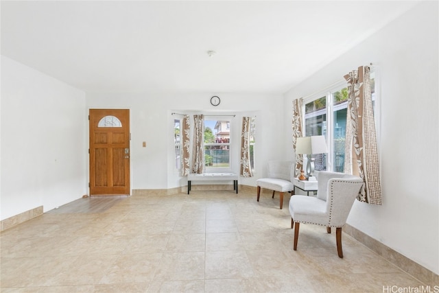 living area with light tile patterned floors