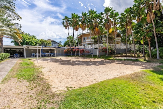 view of home's community with a yard and volleyball court