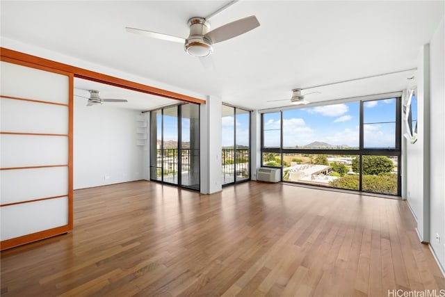 interior space featuring hardwood / wood-style flooring and expansive windows