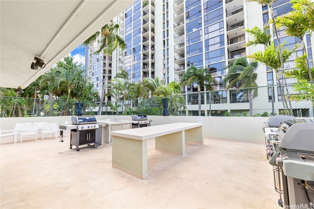 view of patio / terrace with grilling area and a balcony