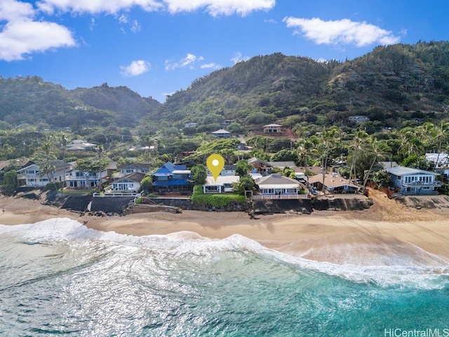 aerial view with a beach view and a water and mountain view