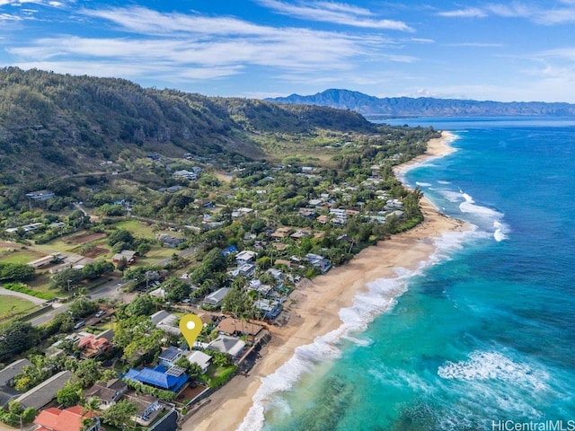 bird's eye view featuring a water and mountain view and a view of the beach