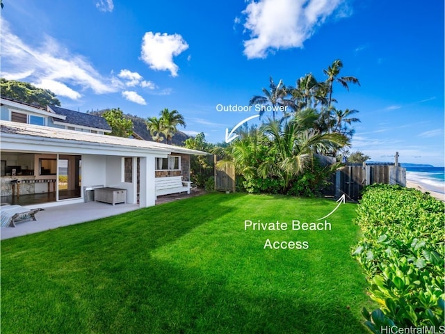 view of yard with a patio area and a water view