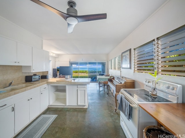 kitchen with kitchen peninsula, backsplash, white electric stove, white cabinetry, and ceiling fan